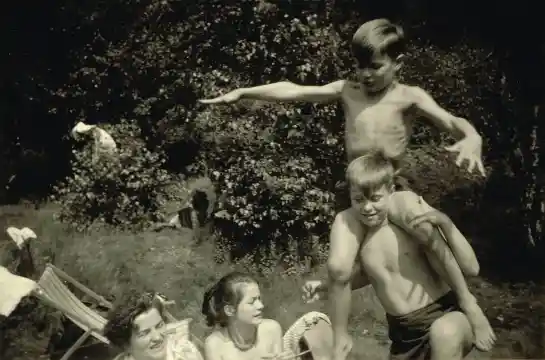 Peter Lindbergh on the shoulders of his brother Horst Brodbeck with his mother, Maria Katarina Brodbeck, and sister Helga Polzin. Entenfang, Ruhr, summer of 1953